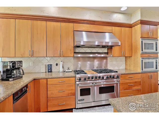 a kitchen with a stove and cabinets