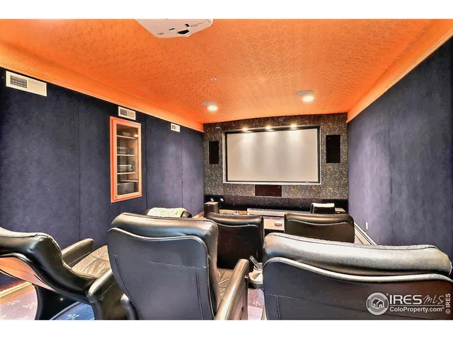 a room with furniture pool table and flat screen tv