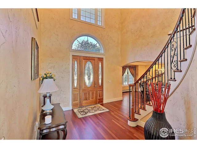 a view of entryway with wooden floor