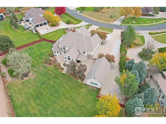 a view of house with yard and green space