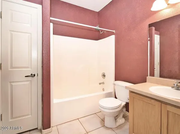 a bathroom with a toilet a sink and bathtub