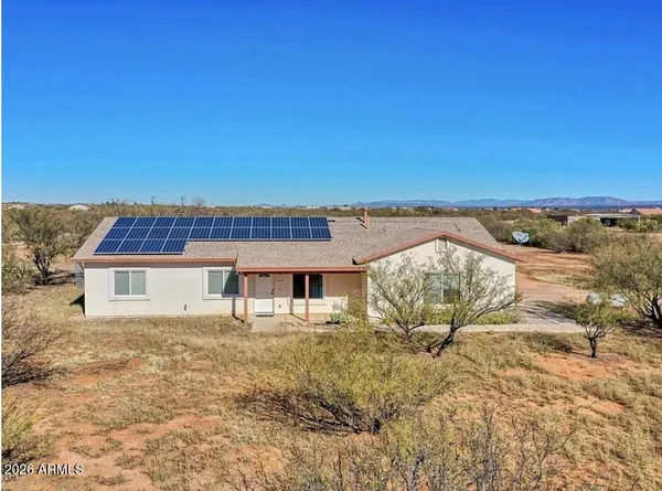 a view of a terrace with a table and chairs
