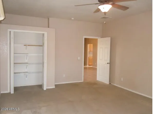 an empty room with closet area