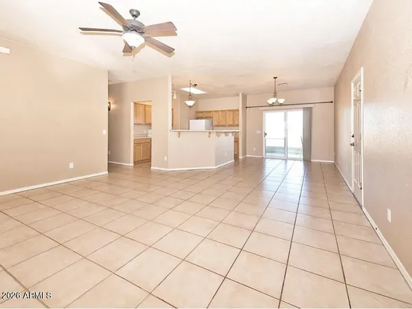 a view of a living room and a ceiling fan