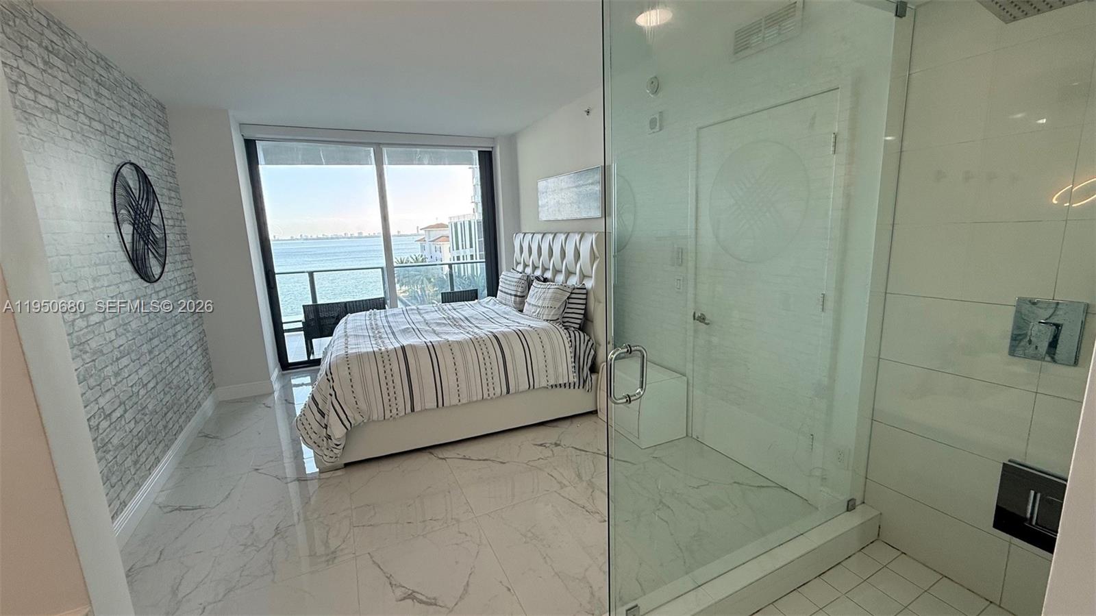 460 Northeast 28th Street, Unit 608 Miami, FL 33137 - Photo 10 of 10 a bedroom with a bed and a window