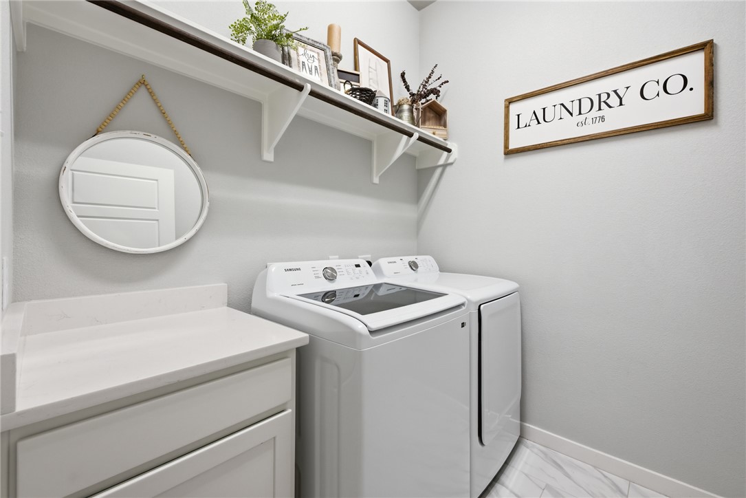 3112 Margaret Rudder Parkway Bryan, TX 77808 - Photo 21 of 24 a utility room with dryer and washer