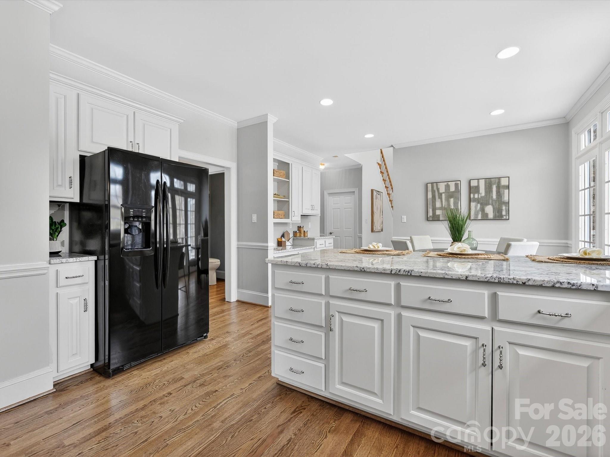 13417 Scanlan Way Davidson, NC 28036 - Photo 13 of 48 a bathroom with a granite countertop sink a refrigerator and a mirror