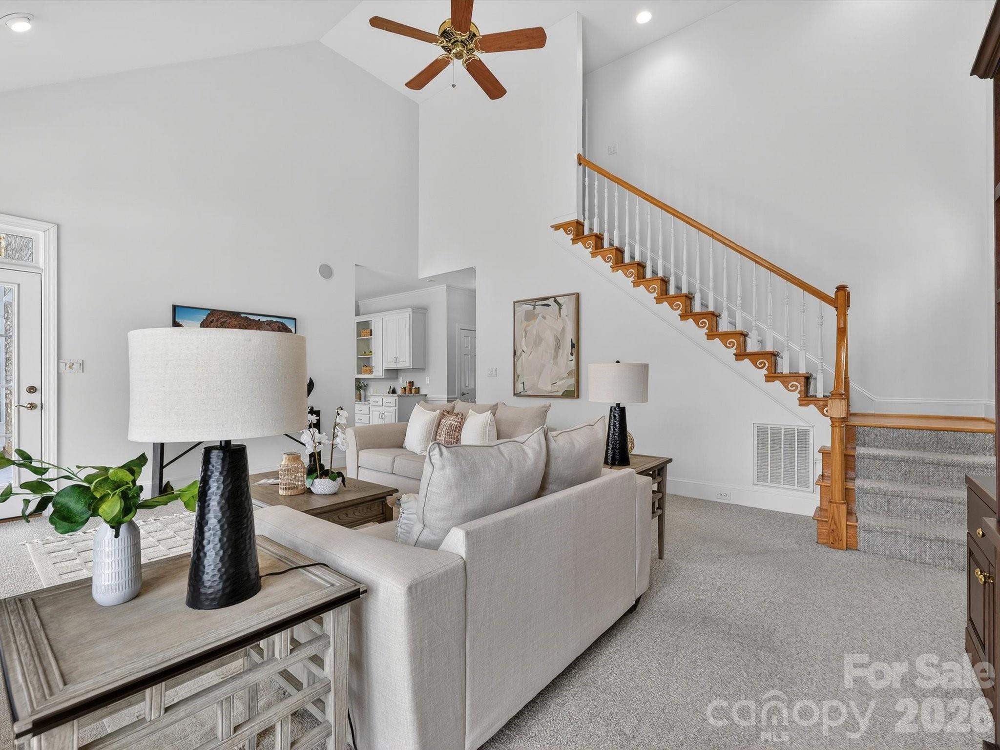 13417 Scanlan Way Davidson, NC 28036 - Photo 18 of 48 a living room with furniture and a potted plant