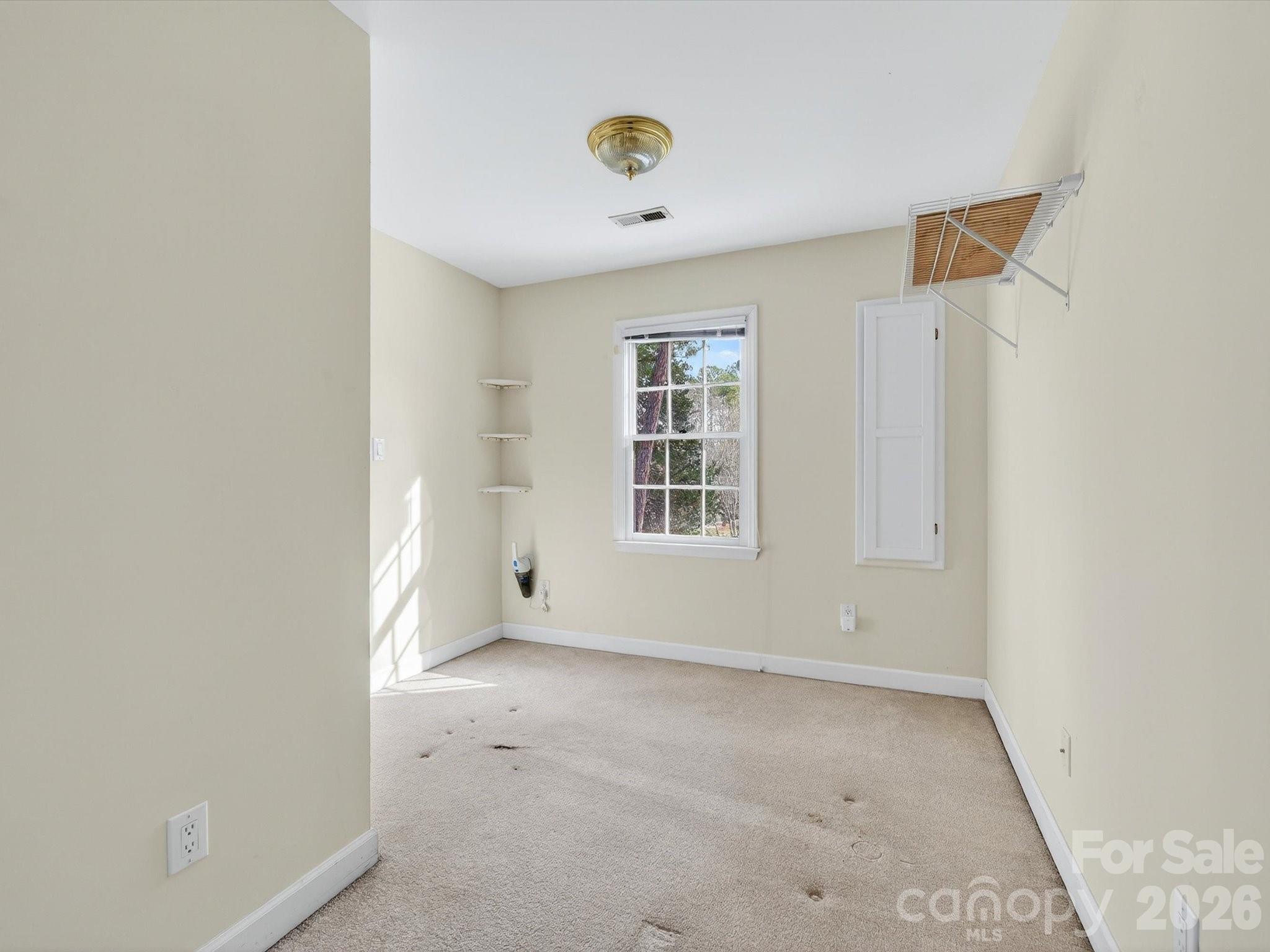 13417 Scanlan Way Davidson, NC 28036 - Photo 30 of 48 an empty room with windows