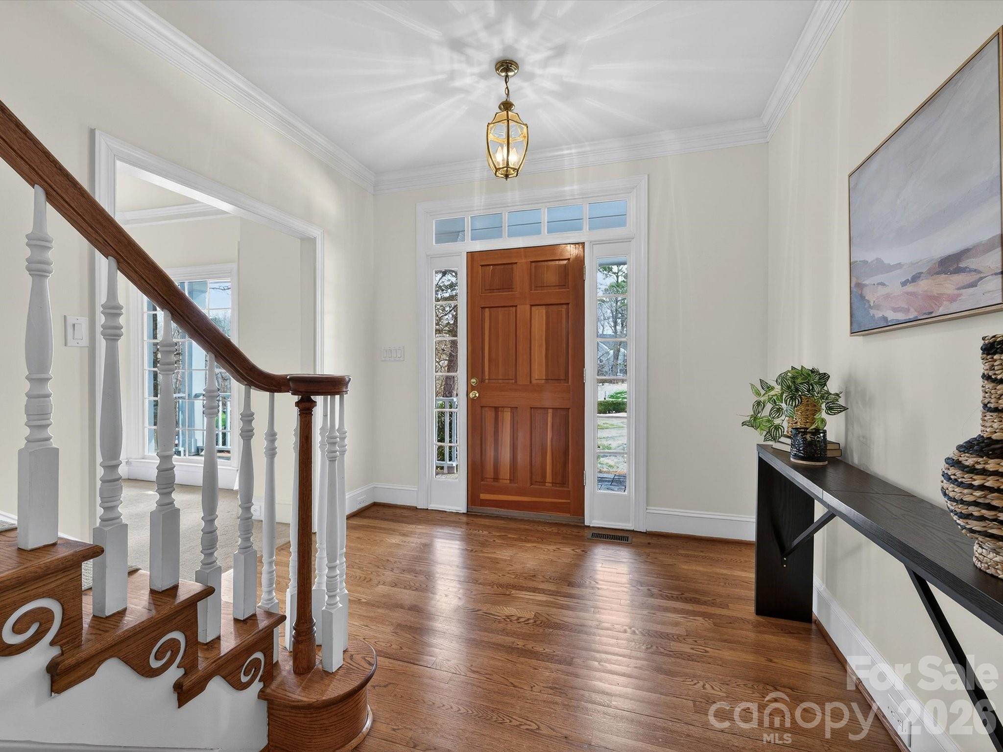 13417 Scanlan Way Davidson, NC 28036 - Photo 3 of 48 a view of a livingroom with wooden floor and stairs