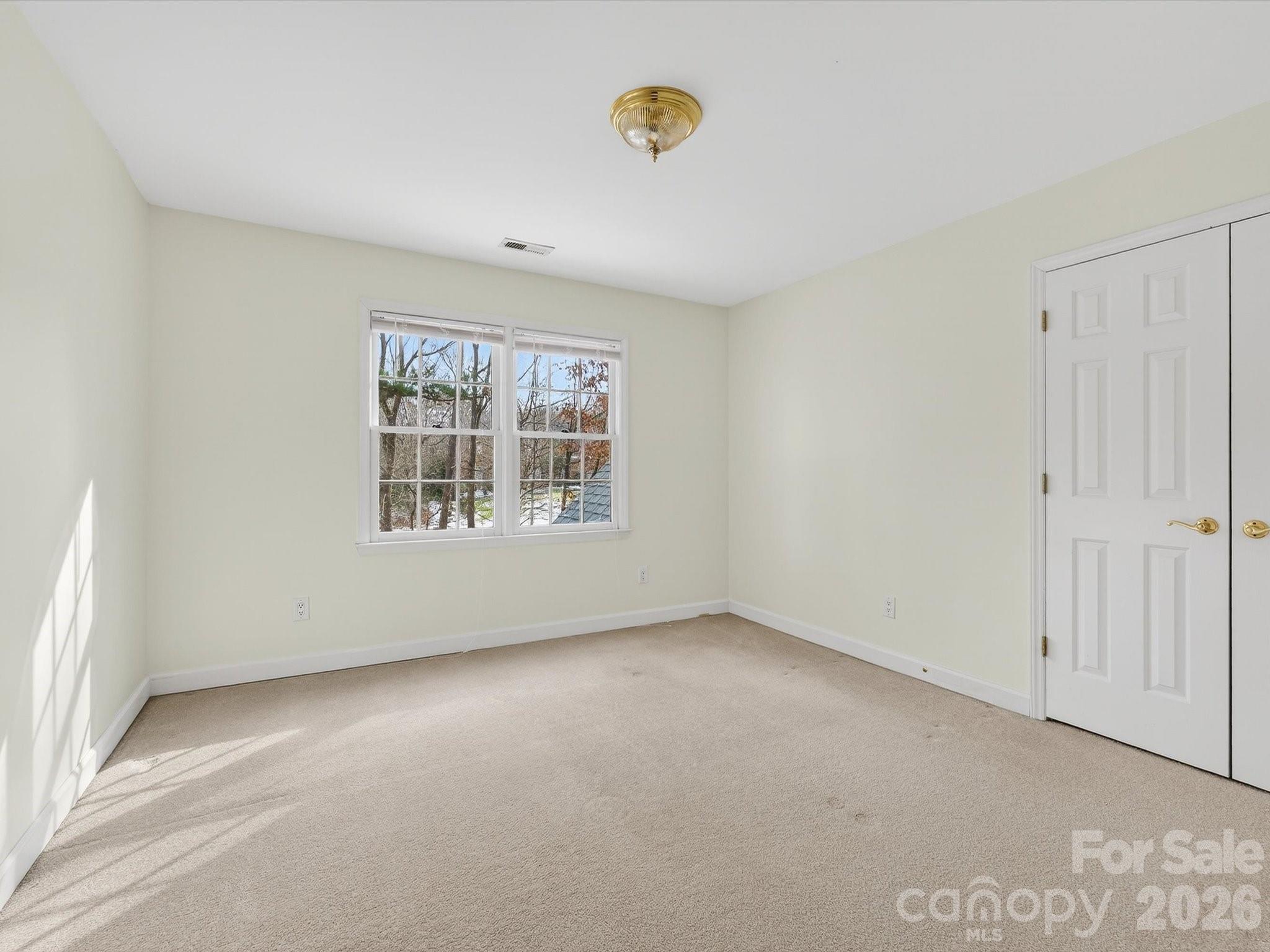 13417 Scanlan Way Davidson, NC 28036 - Photo 32 of 48 an empty room with windows