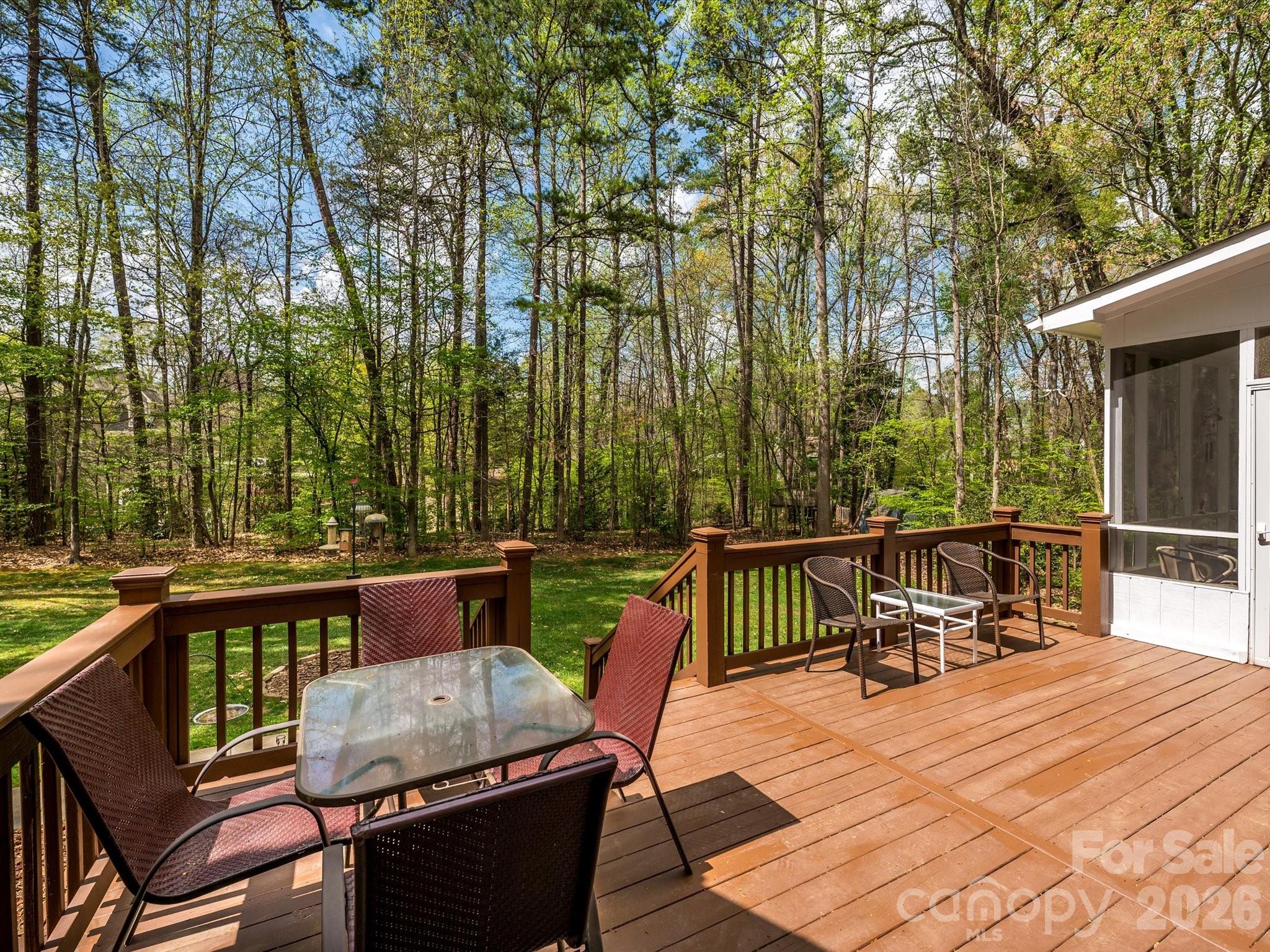 13417 Scanlan Way Davidson, NC 28036 - Photo 37 of 48 a patio with glass top table and chairs