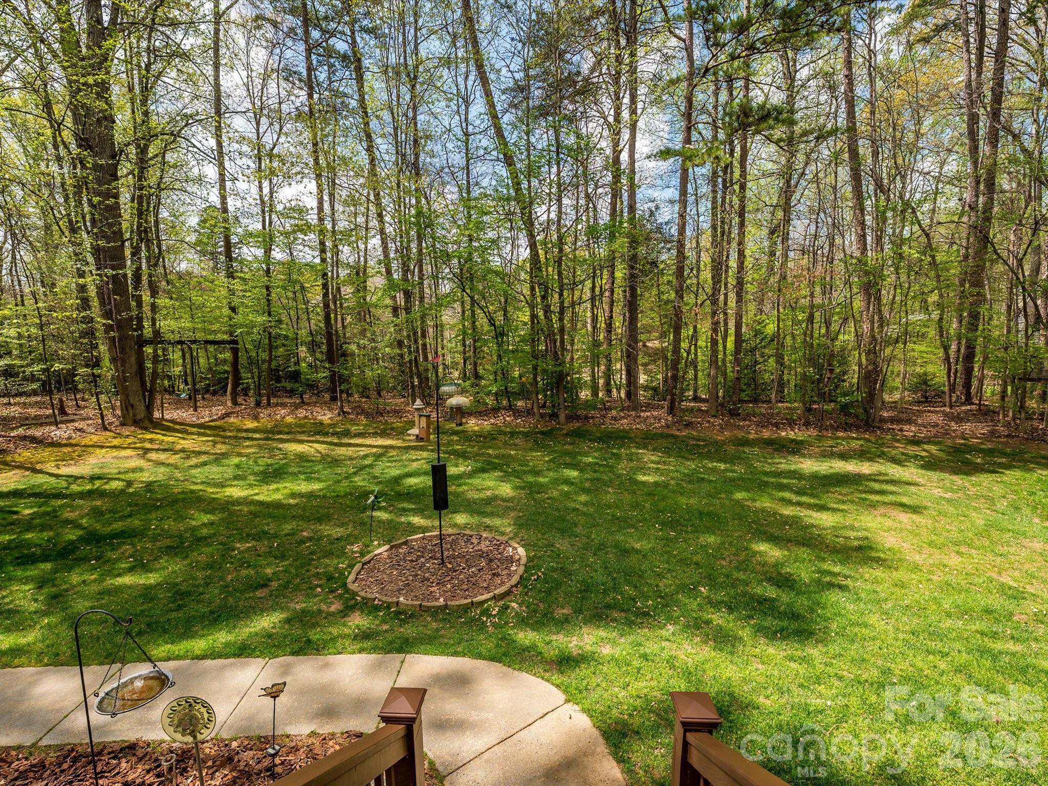 13417 Scanlan Way Davidson, NC 28036 - Photo 39 of 48 a backyard of a house with lots of green space and fountain