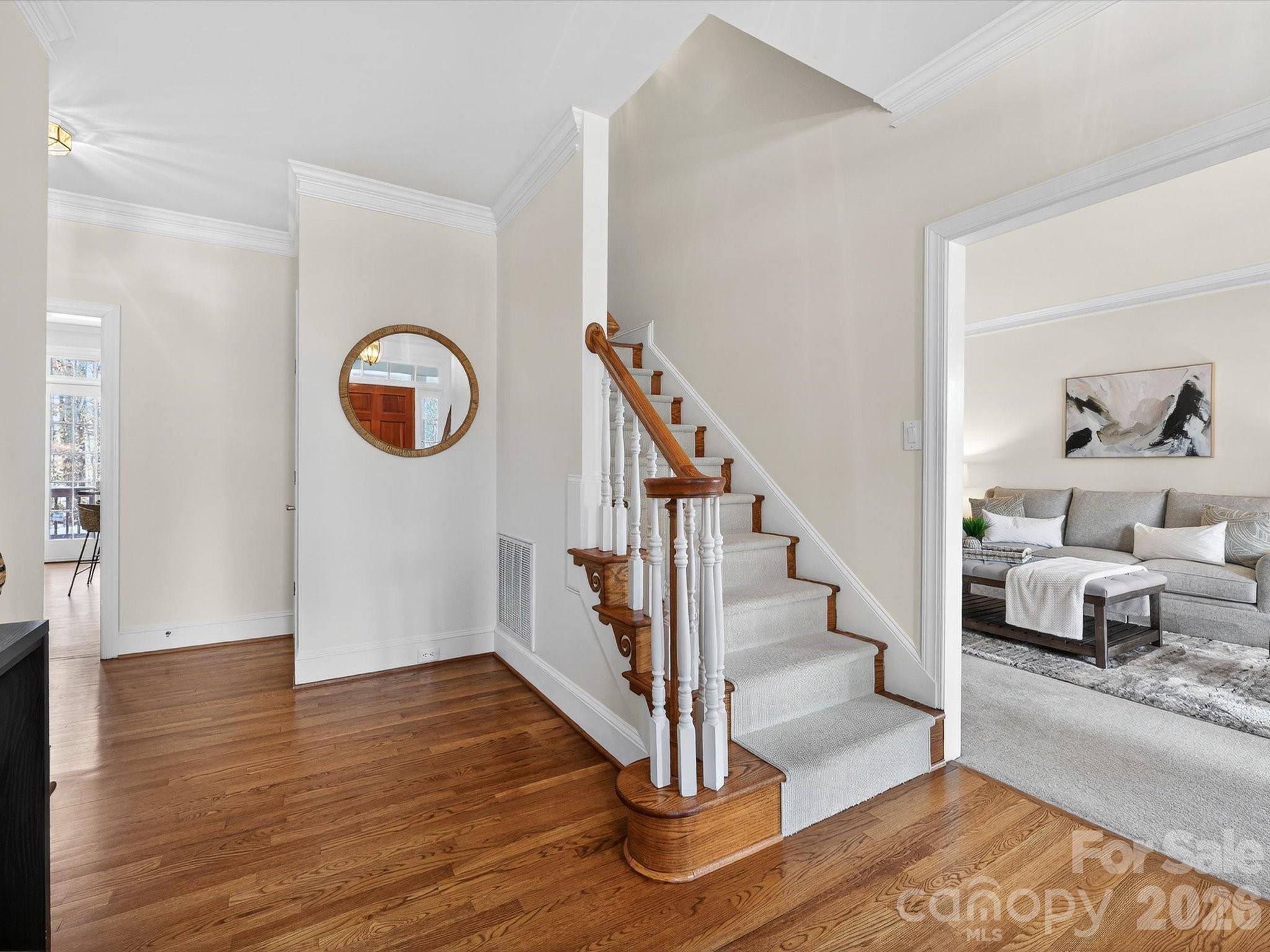 13417 Scanlan Way Davidson, NC 28036 - Photo 4 of 48 a view of entryway and hall with wooden floor