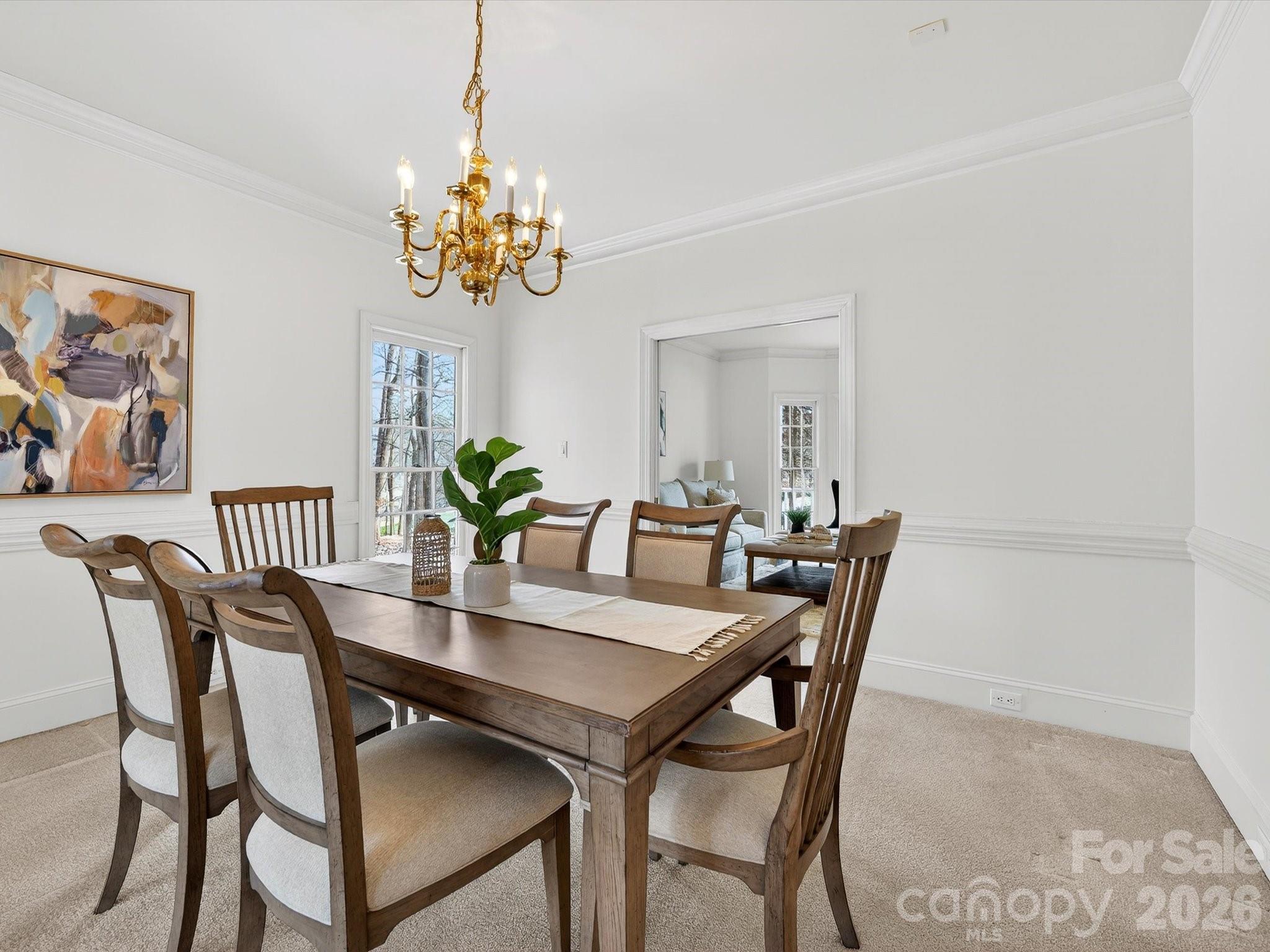 13417 Scanlan Way Davidson, NC 28036 - Photo 9 of 48 a view of a dining room with furniture and chandelier