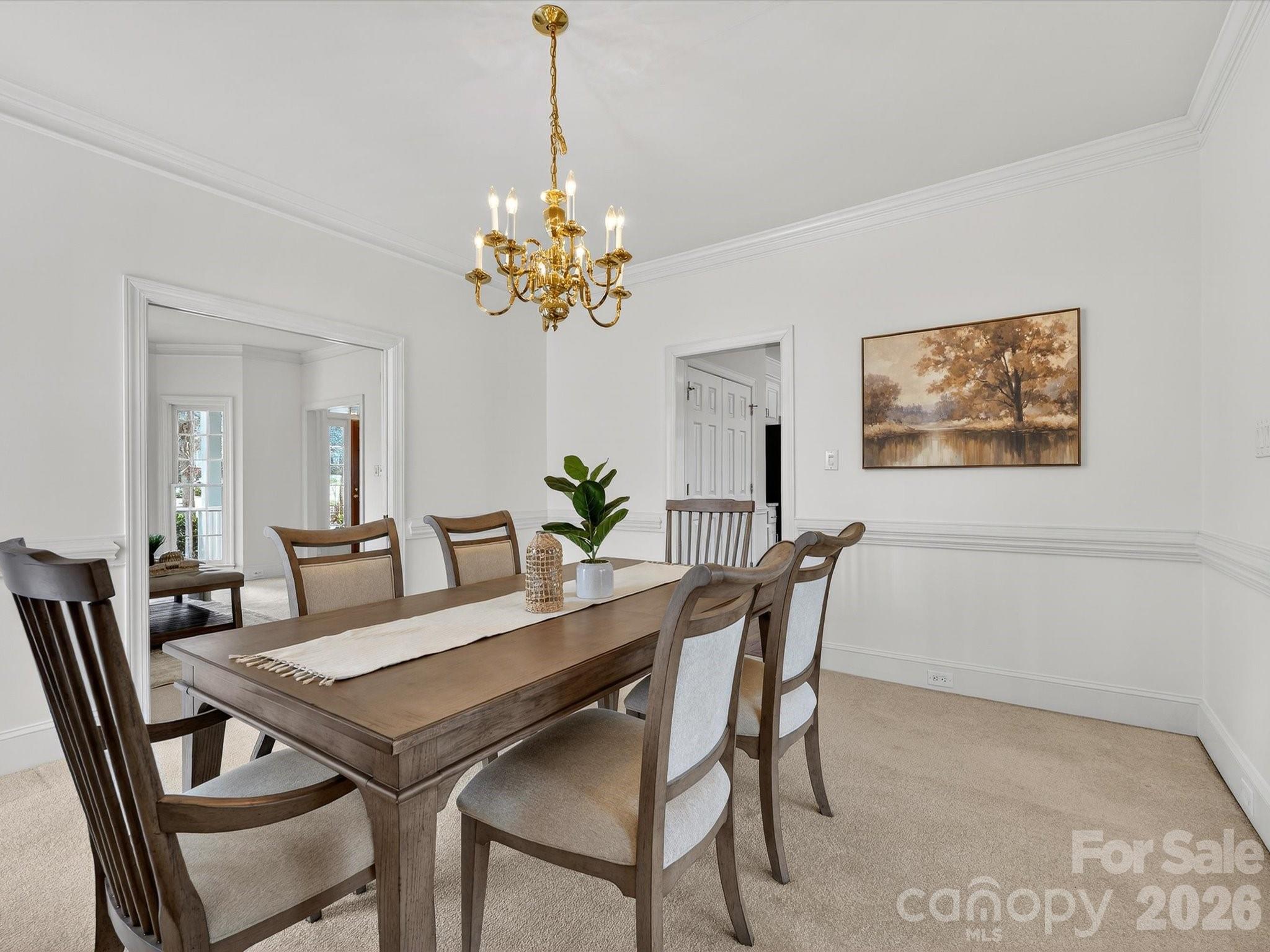 13417 Scanlan Way Davidson, NC 28036 - Photo 10 of 48 a view of a dining room with furniture and chandelier