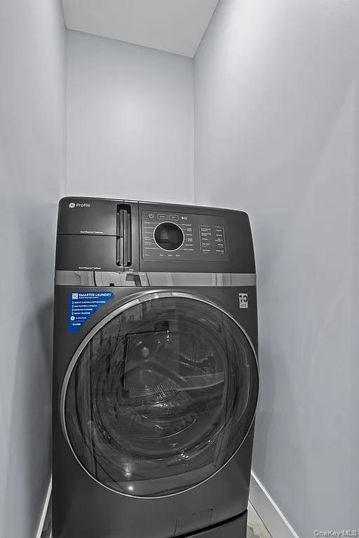 581 Decatur Street Brooklyn, NY 11233 - Photo 12 of 12 a utility room with washing machine