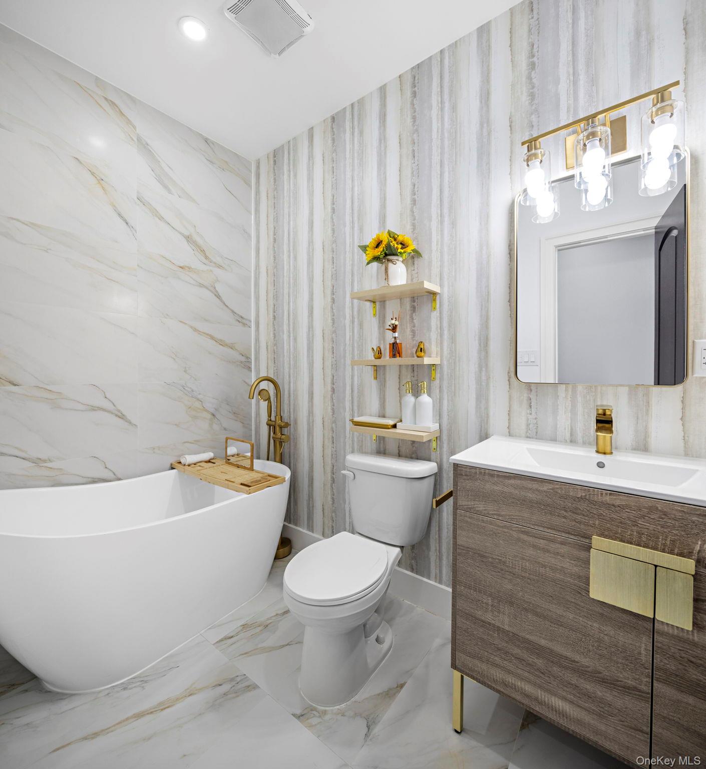 581 Decatur Street Brooklyn, NY 11233 - Photo 9 of 12 a bathroom with a toilet a sink and bathtub
