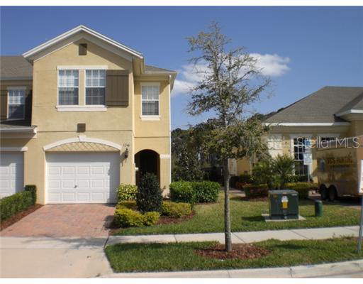 3246 Villa Strada Way Orlando, FL 32835 - Photo 1 of 1 a front view of a house with garden