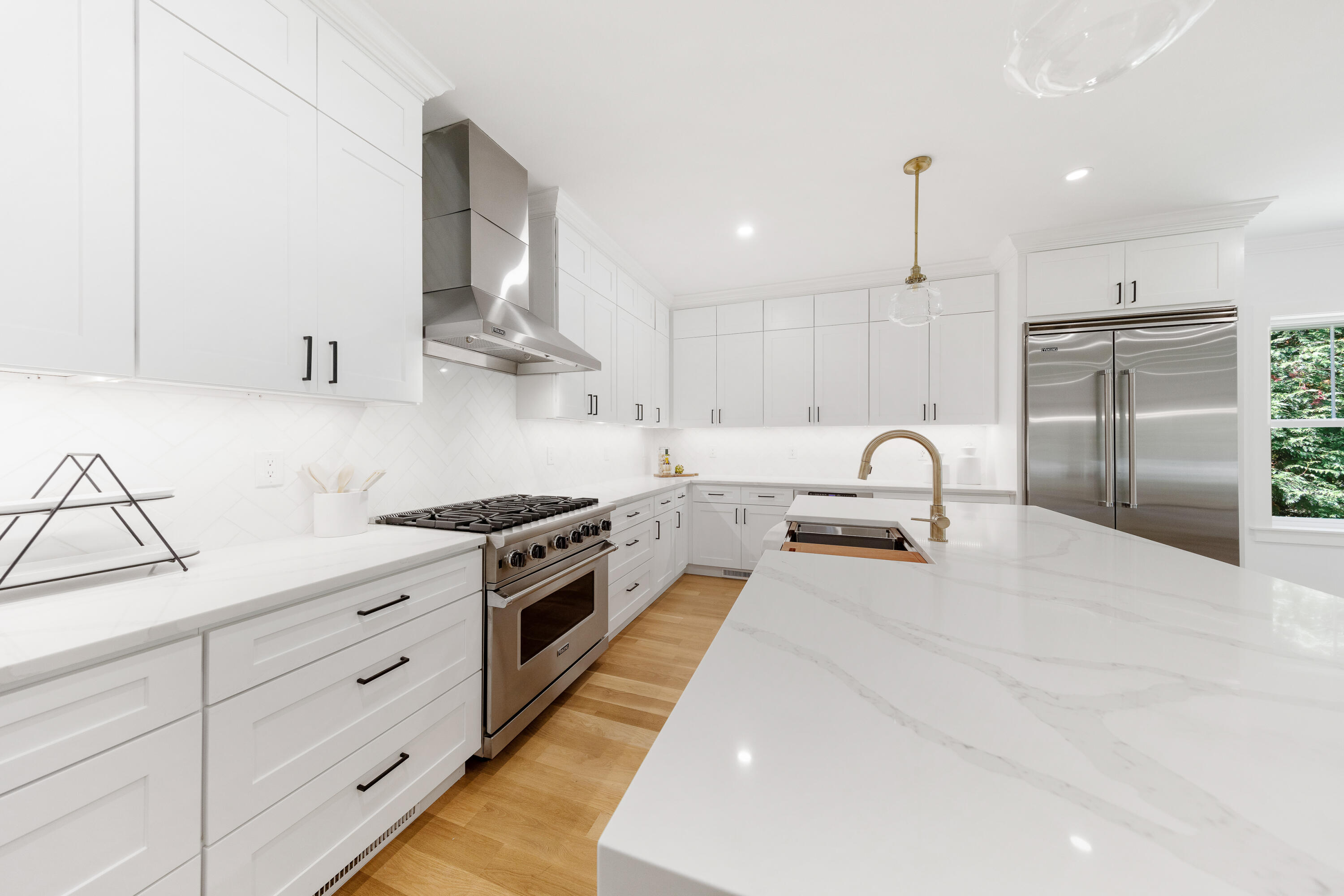 14 Edgewood Road Darien, CT 06820 - Photo 12 of 38 a kitchen with stainless steel appliances granite countertop a sink a stove and a refrigerator