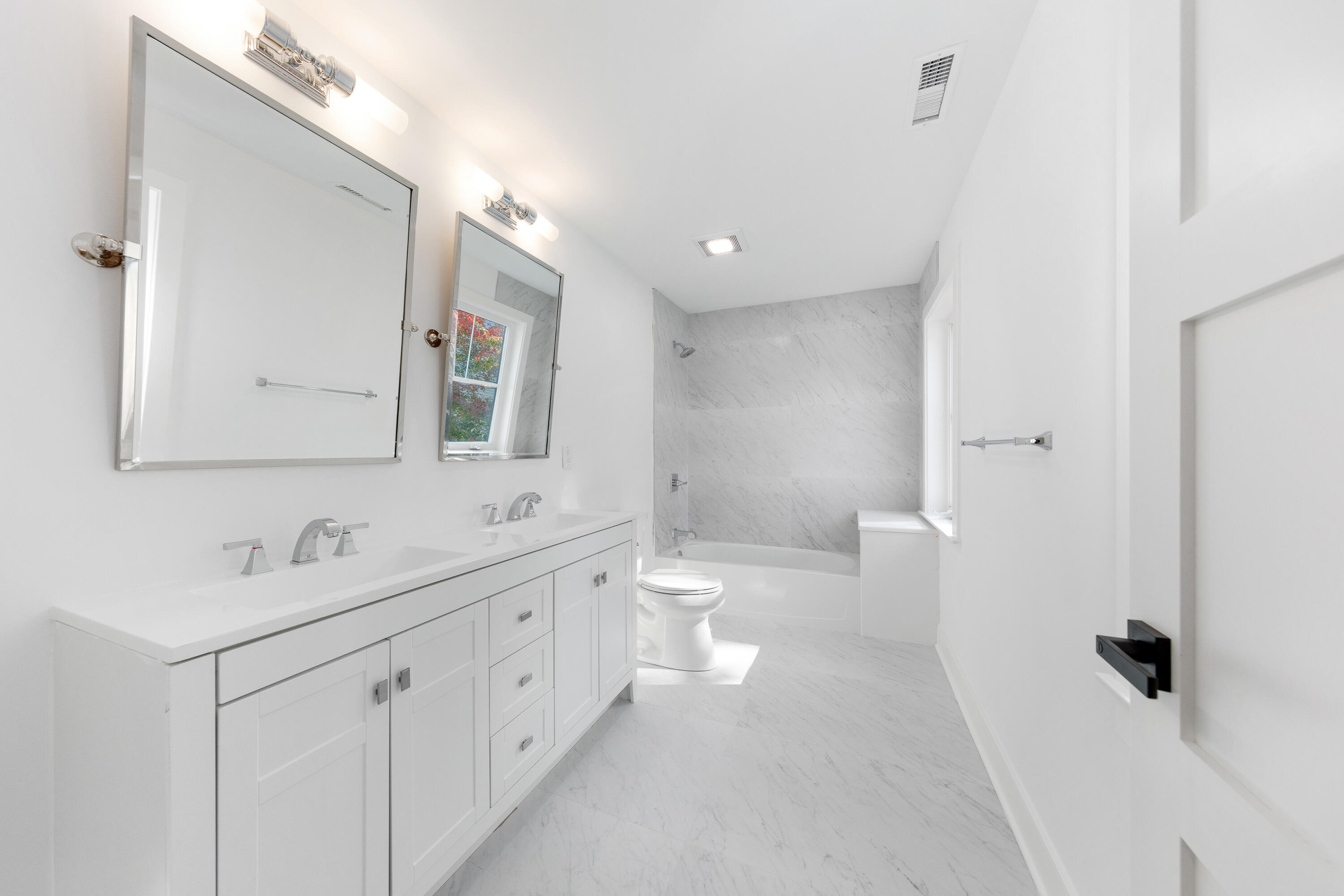 14 Edgewood Road Darien, CT 06820 - Photo 25 of 38 a bathroom with a double vanity sink a toilet and a mirror