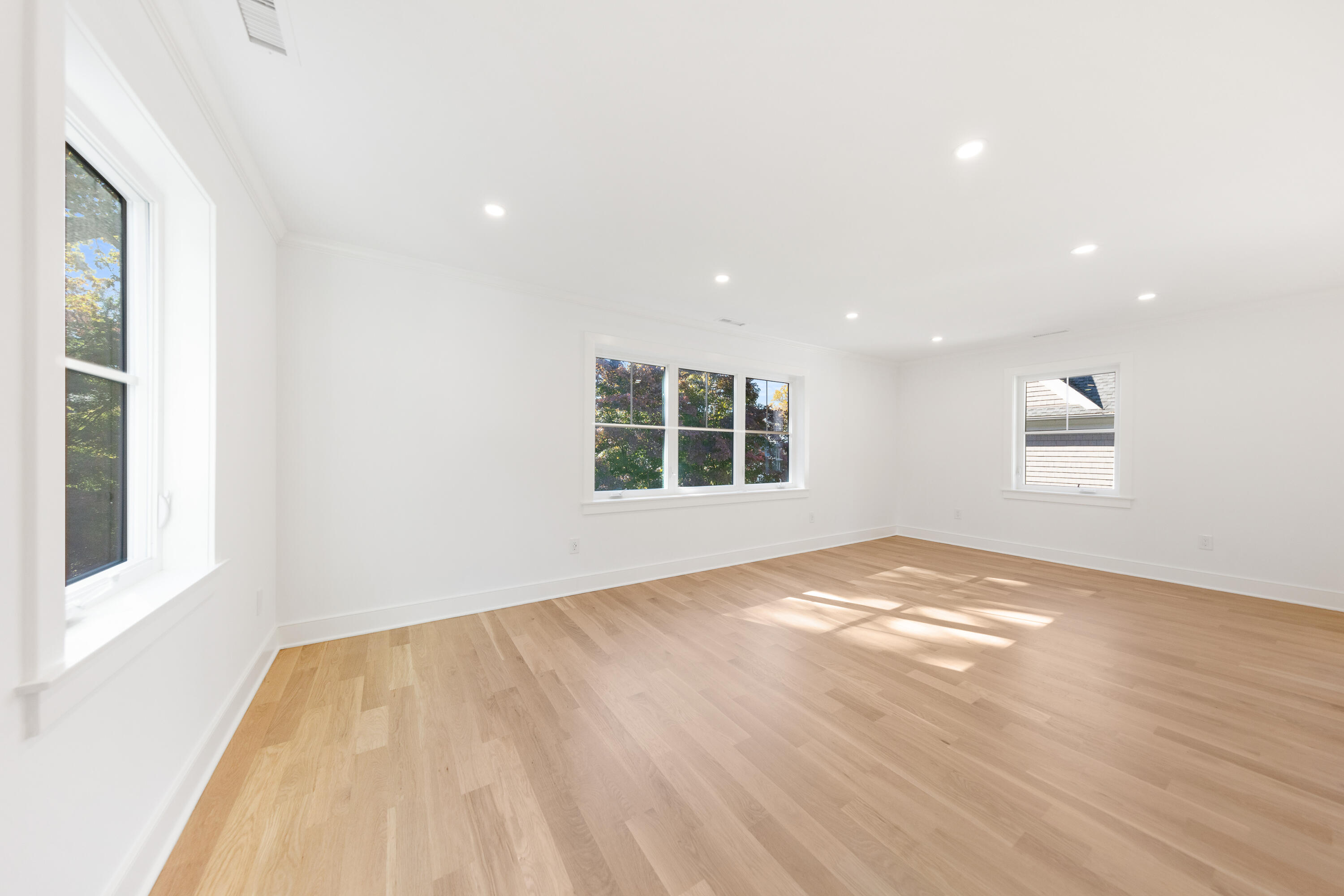 14 Edgewood Road Darien, CT 06820 - Photo 26 of 38 a view of empty room with wooden floor and fan