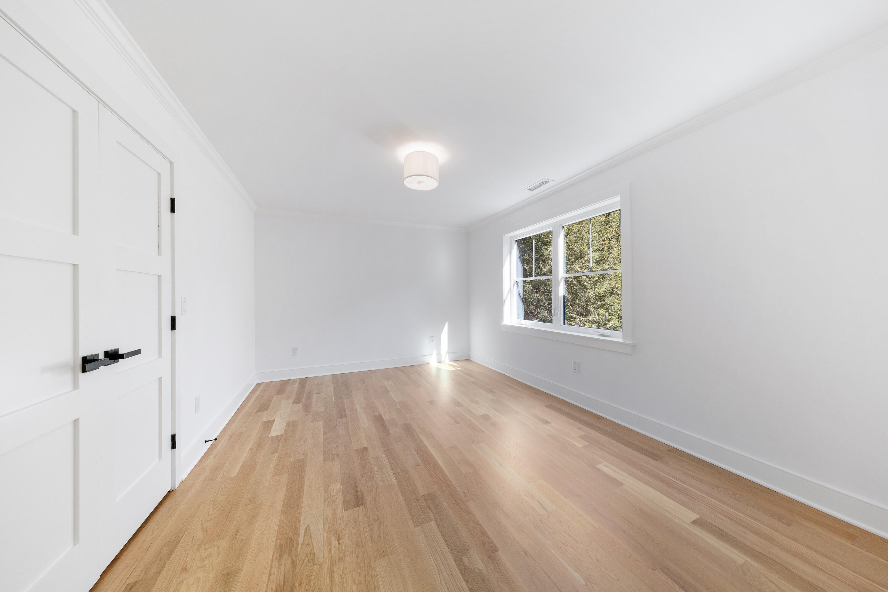 14 Edgewood Road Darien, CT 06820 - Photo 27 of 38 wooden floor in an empty room with a window