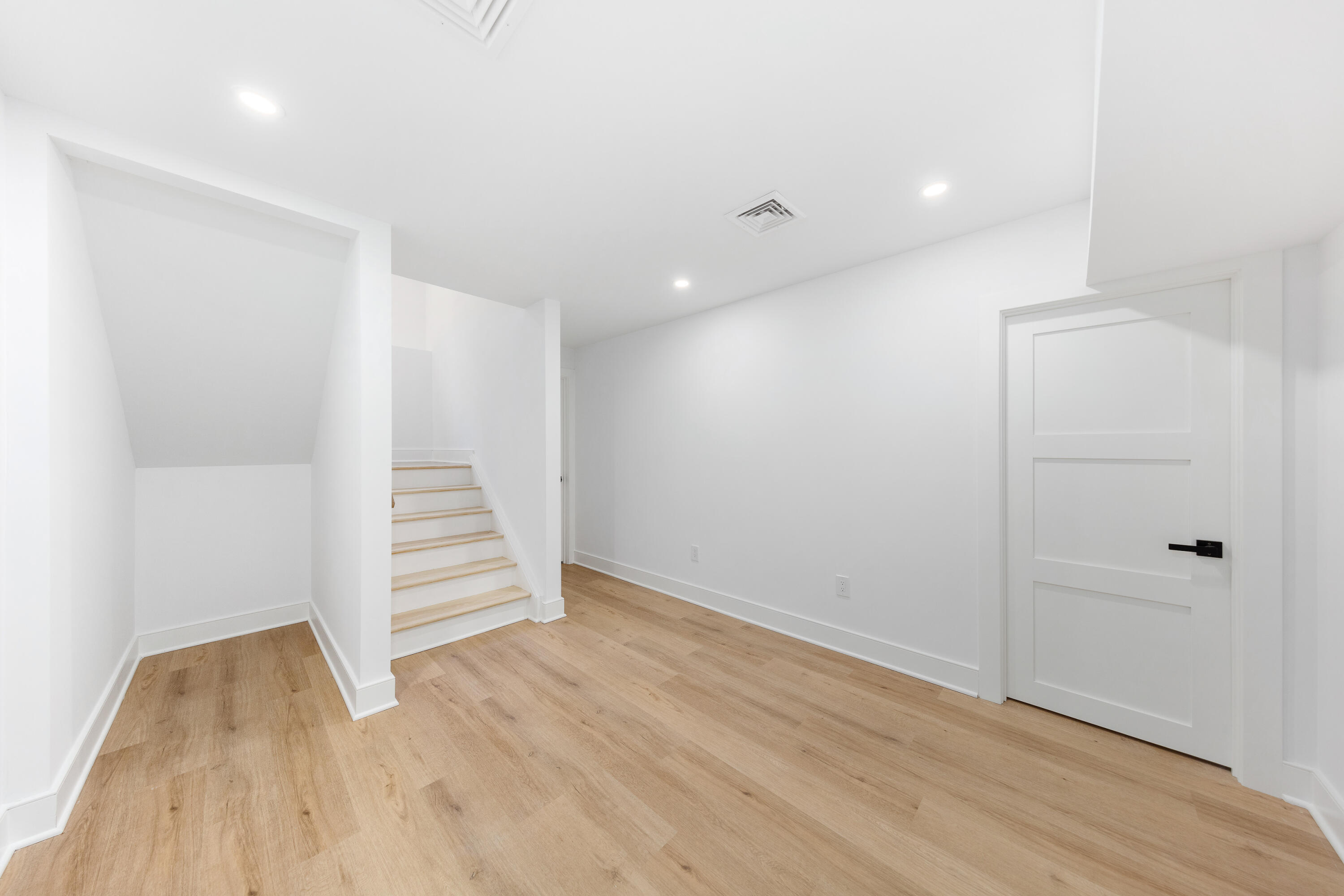 14 Edgewood Road Darien, CT 06820 - Photo 31 of 38 an empty room with wooden floor and white walls