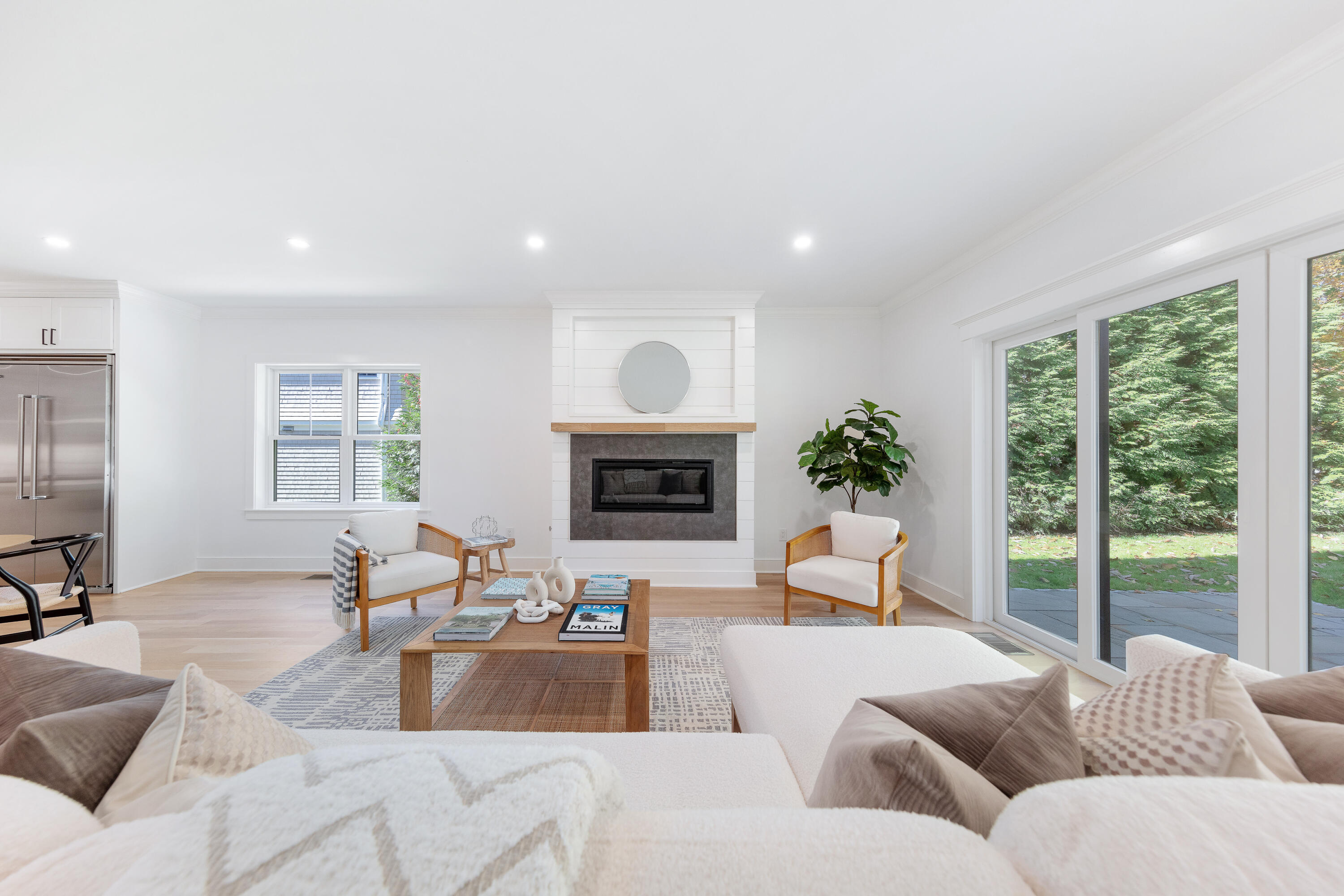 14 Edgewood Road Darien, CT 06820 - Photo 6 of 38 a living room with furniture fireplace and a large window