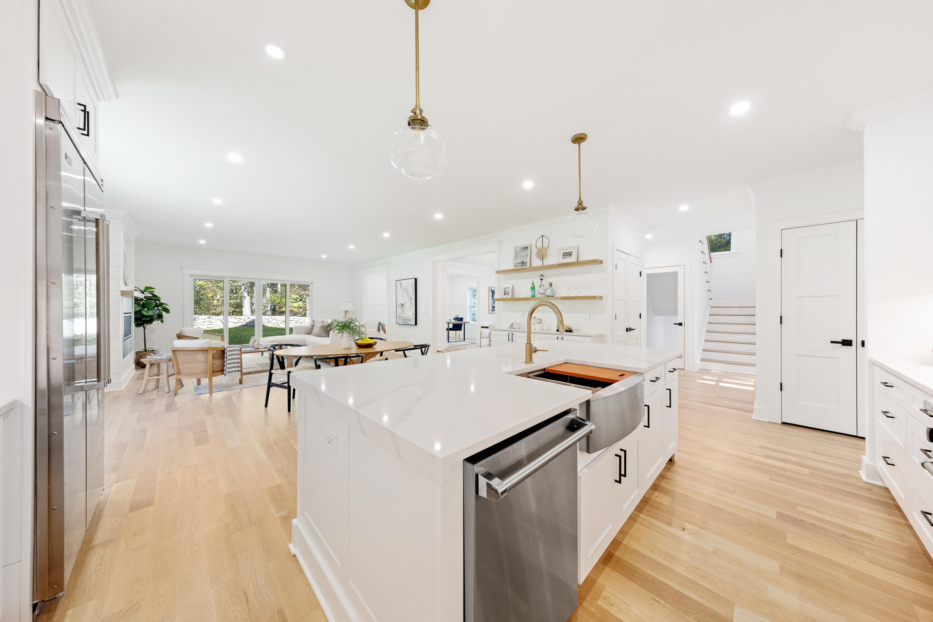 14 Edgewood Road Darien, CT 06820 - Photo 10 of 38 a large kitchen with stainless steel appliances kitchen island a large counter top a stove a chimney a sink and cabinets