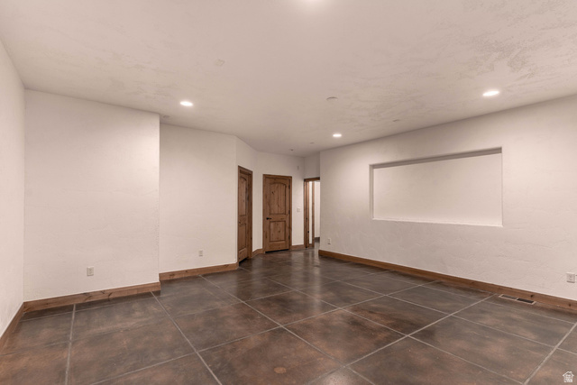 2464 East Granite Way St. George, UT 84790 - Photo 94 of 106 Empty great room featuring baseboards and recessed lighting