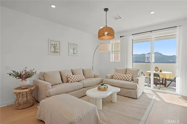 a view of a livingroom with wooden floor