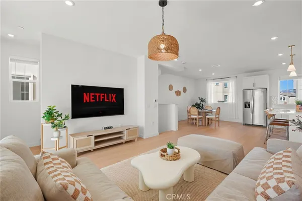 a bedroom with a bed and a table with mirror