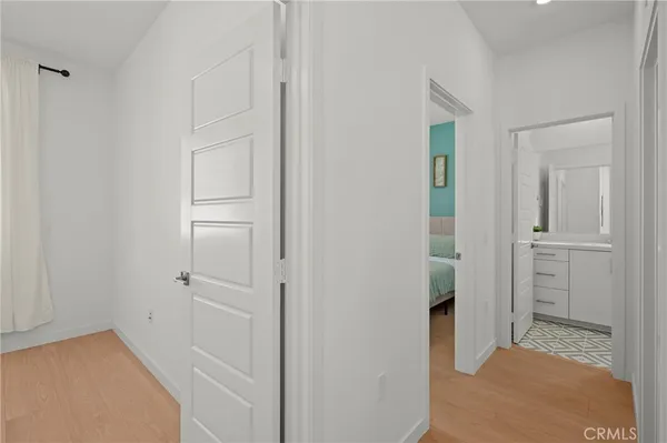 a bedroom with a bed and a night stand