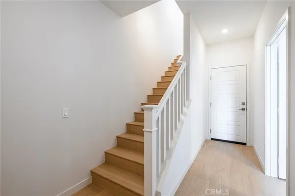 a view of a hallway with stairs