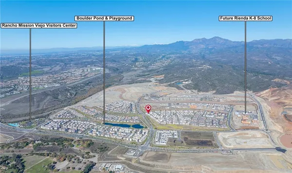 a view of an ocean and residential houses with outdoor space