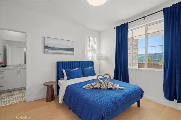 a bedroom with a bed and window
