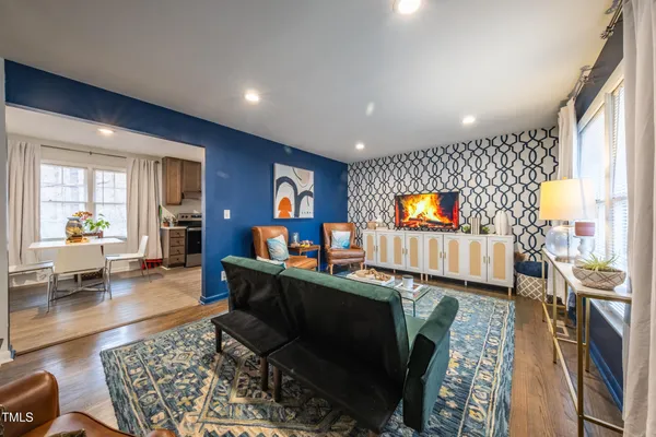 a living room with furniture and a flat screen tv
