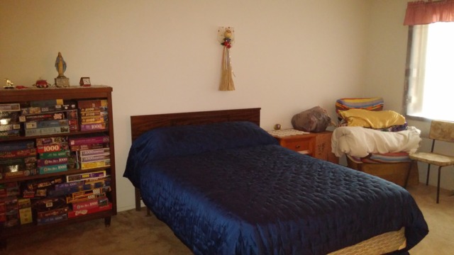 1104 Springinsguth Road, Unit 1B Schaumburg, IL 60193 - Photo 9 of 11 a bedroom with a bed and a window