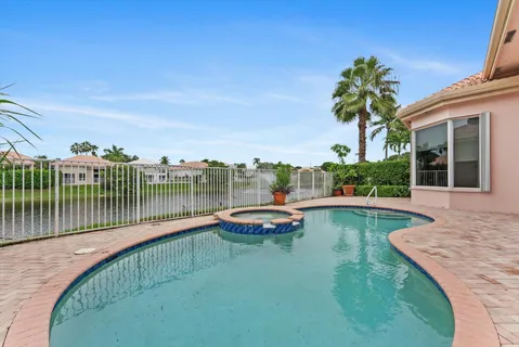 a view of a swimming pool with a patio