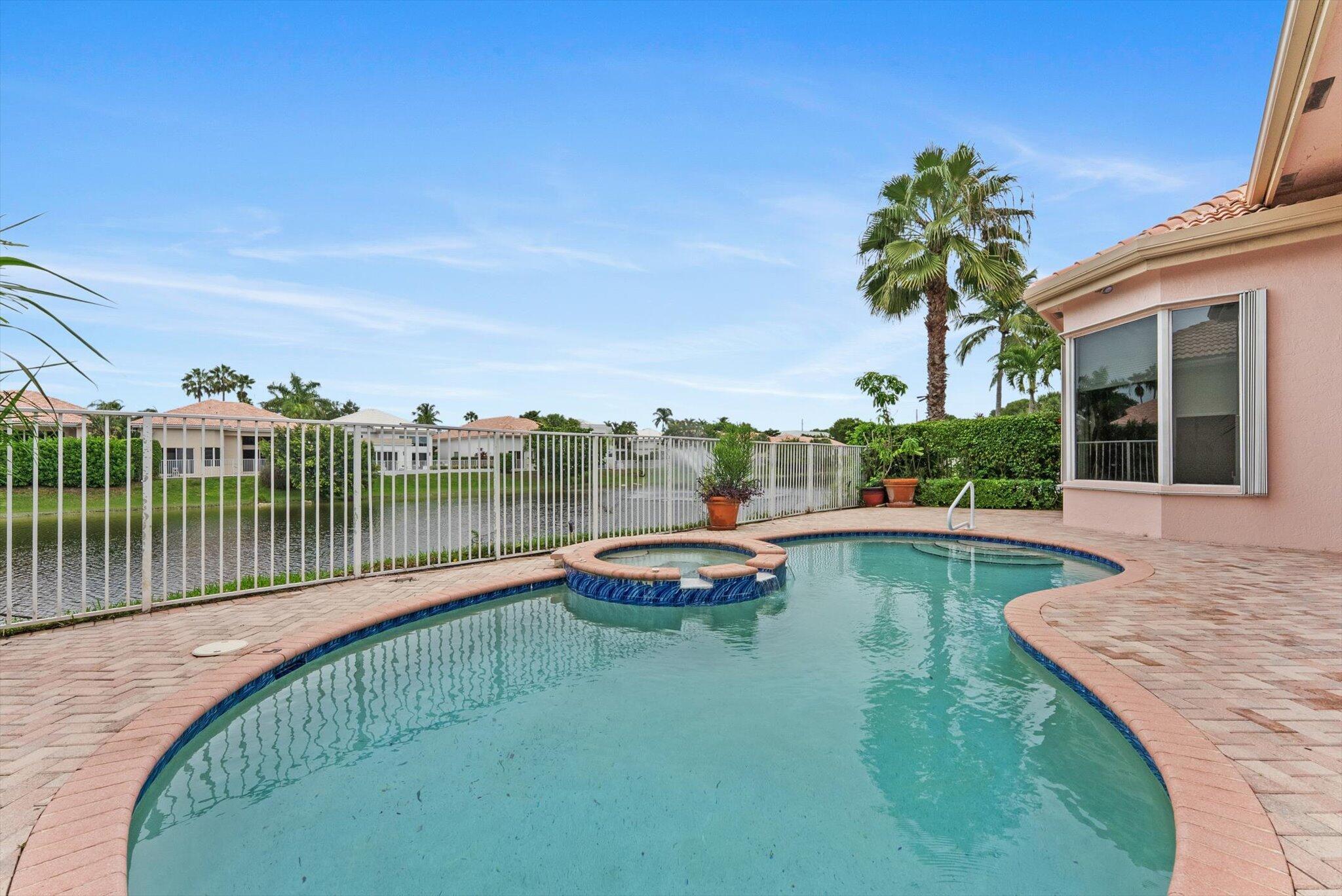 7081 Mallorca Crescent Boca Raton, FL 33433 - Photo 19 of 26 a view of a swimming pool with a patio