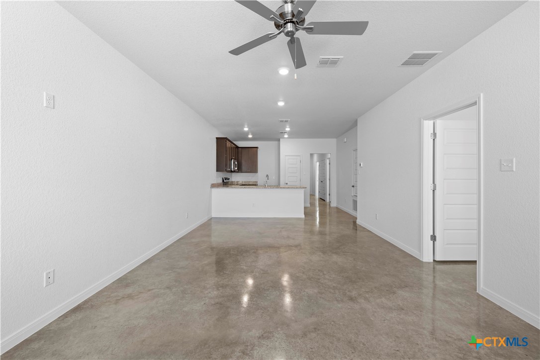 2819 Quail Rdg Lane Temple, TX 76501 - Photo 9 of 17 an empty room with a empty space and a ceiling fan