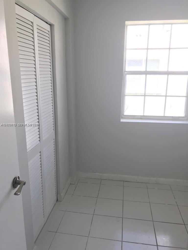 2224 Southwest 11th Street, Unit 3 Miami, FL 33135 - Photo 13 of 15 a view of an empty room with a window