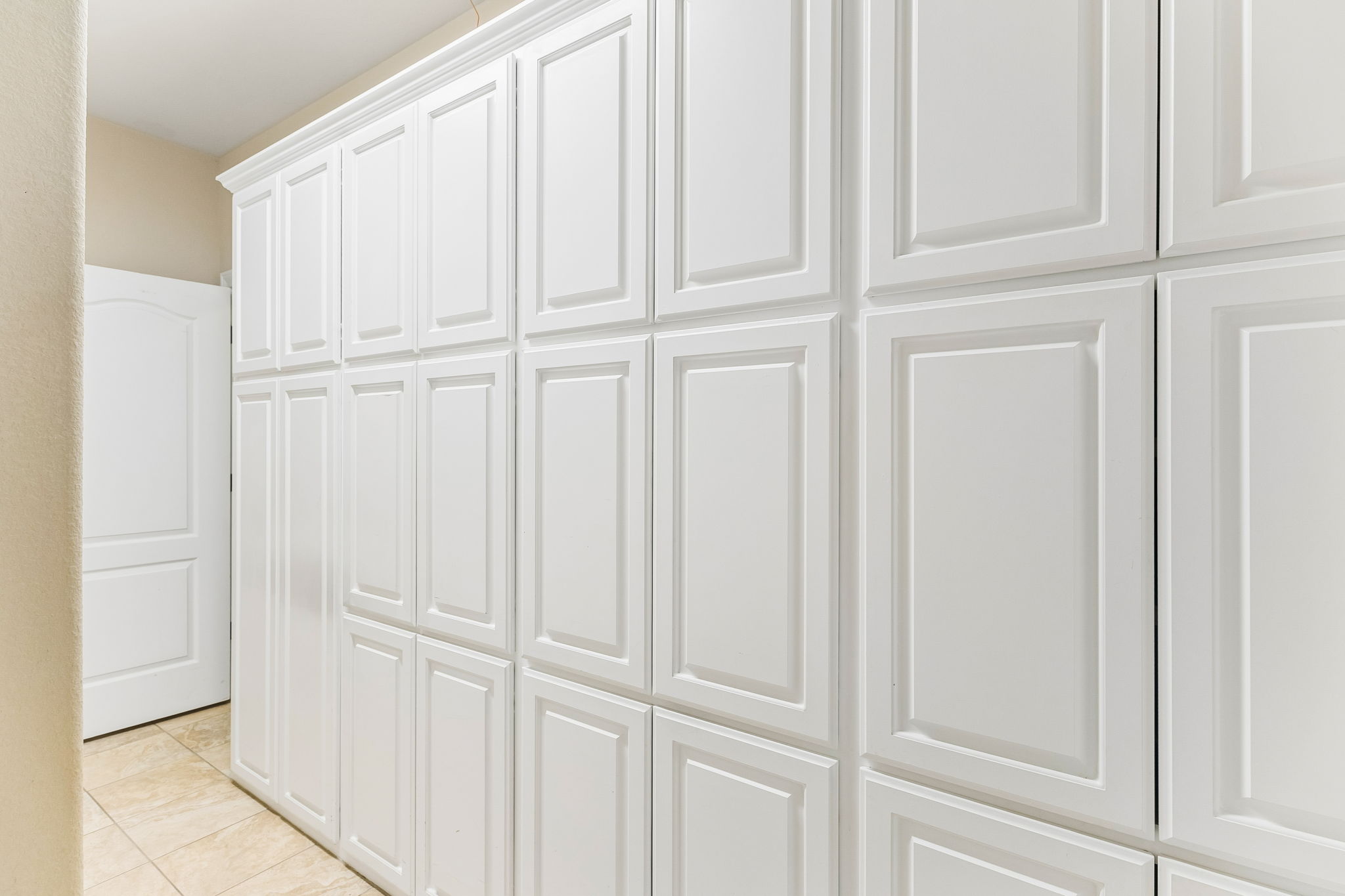 4802 Hidden Springs Trail Georgetown, TX 78633 - Photo 32 of 38 A wall of storage in the utility room!