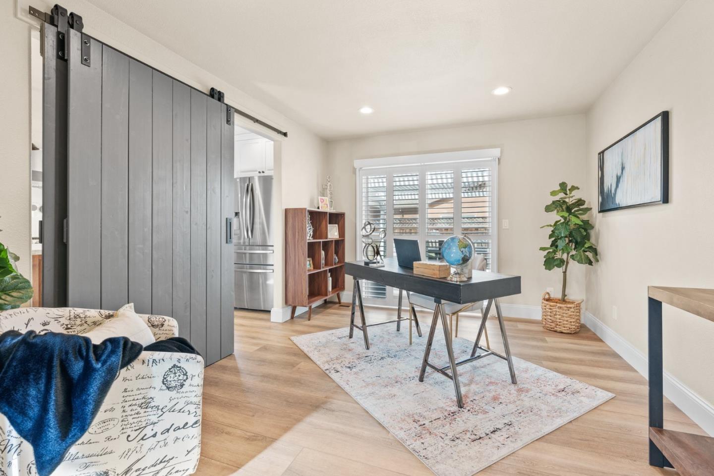 75 Paloma Drive Morgan Hill, CA 95037 - Photo 19 of 53 a living room with a couch and a potted plant