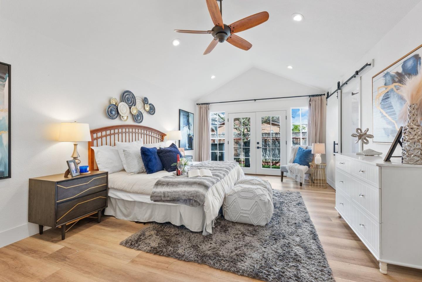 75 Paloma Drive Morgan Hill, CA 95037 - Photo 20 of 53 a bedroom with a large bed and a chandelier