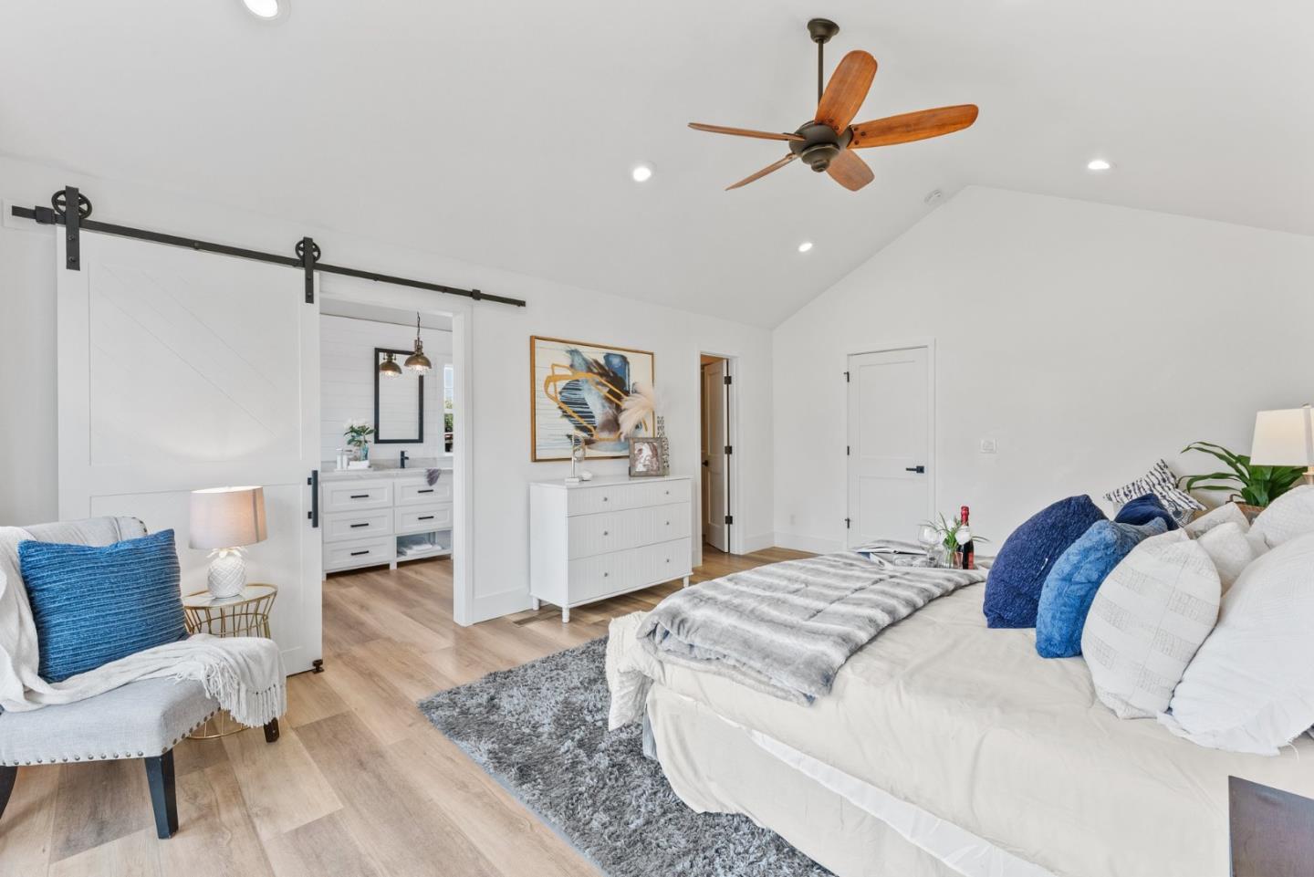 75 Paloma Drive Morgan Hill, CA 95037 - Photo 22 of 53 a bedroom with a bed and a chandelier