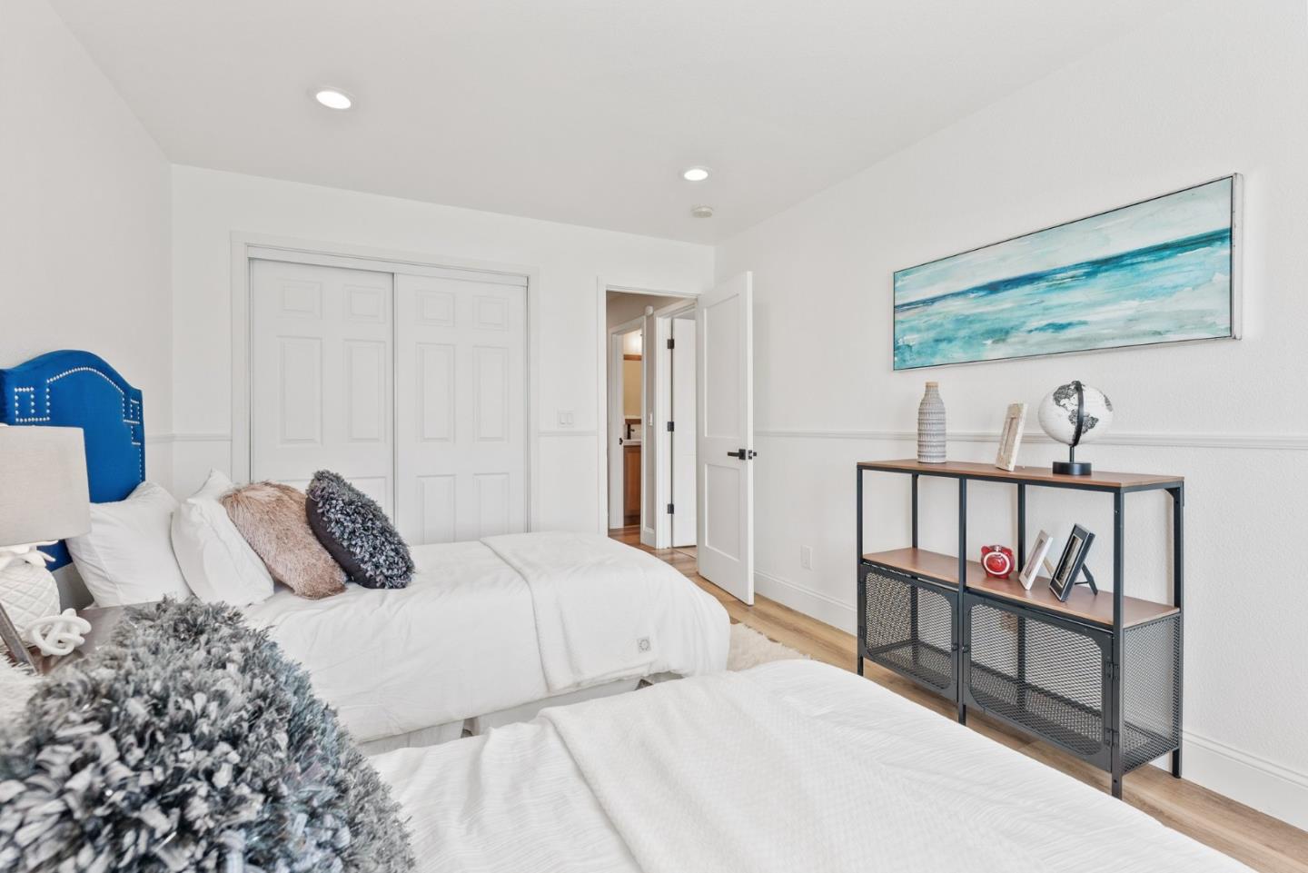 75 Paloma Drive Morgan Hill, CA 95037 - Photo 29 of 53 a bedroom with a bed a dresser and a book shelf