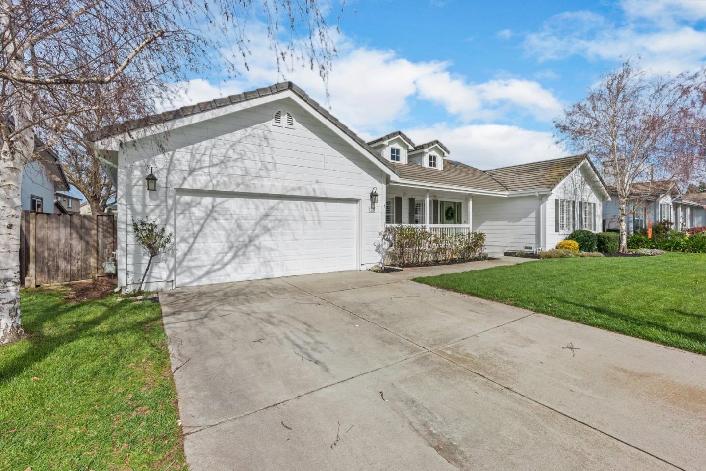 75 Paloma Drive Morgan Hill, CA 95037 - Photo 3 of 53 a front view of a house with a garden and plants