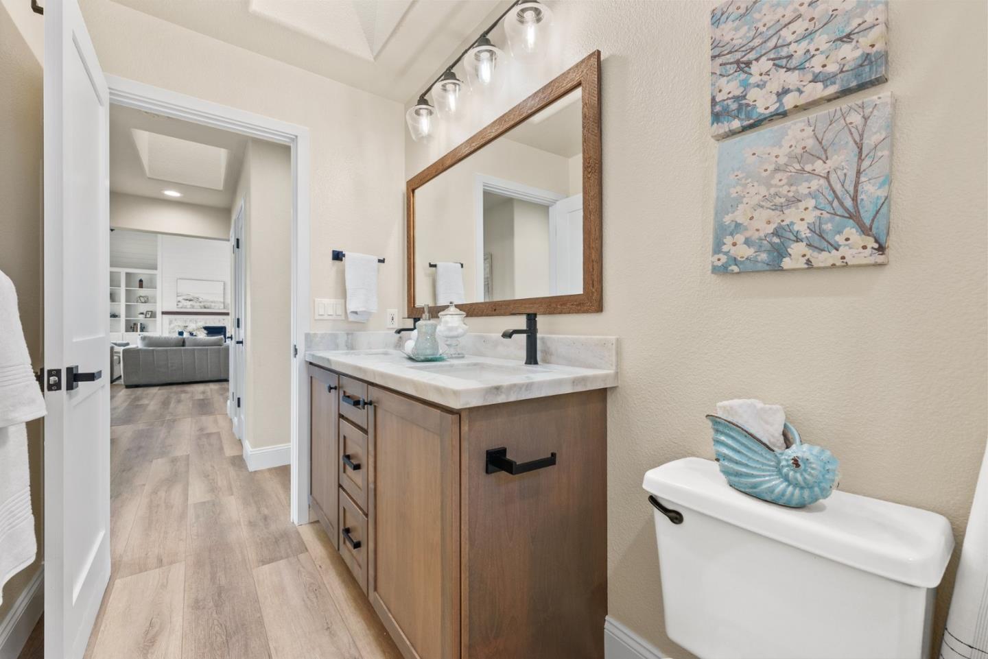 75 Paloma Drive Morgan Hill, CA 95037 - Photo 33 of 53 a spacious bathroom with a toilet sink and mirror